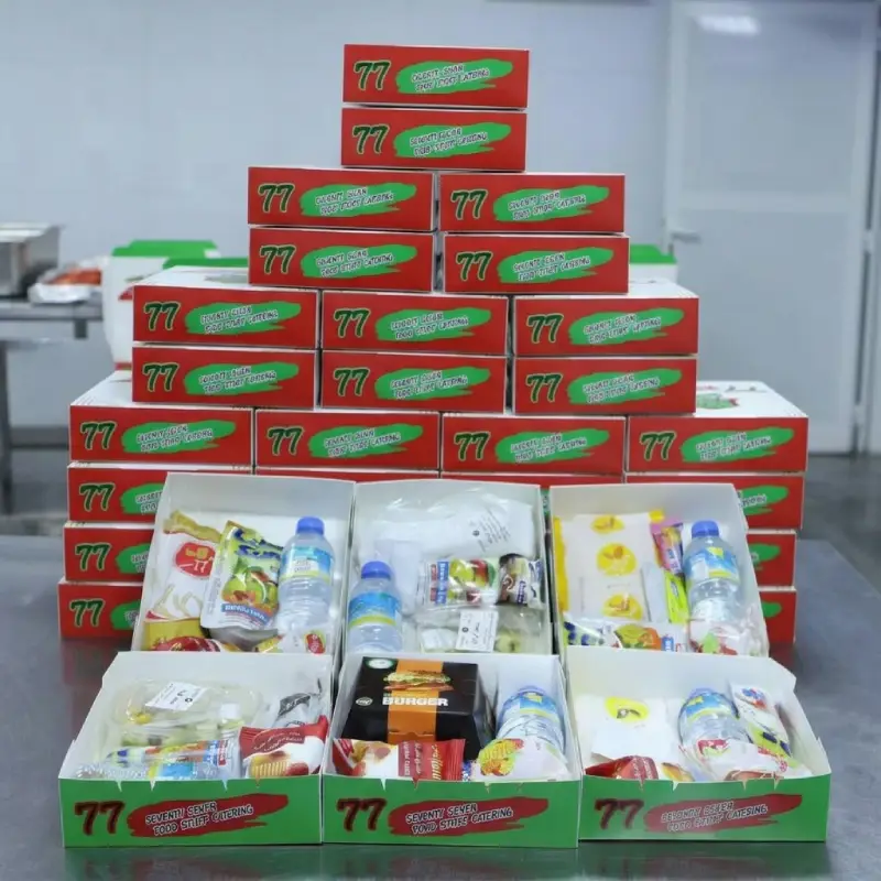 Stacked Seventy Seven meal boxes ready for delivery