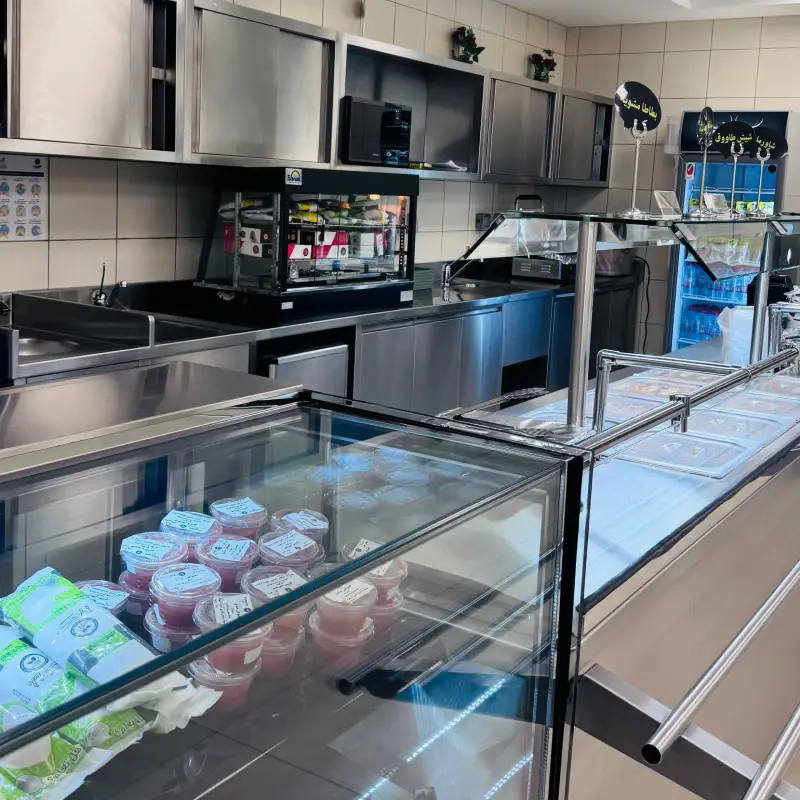 School canteen display counter with desserts and drinks
