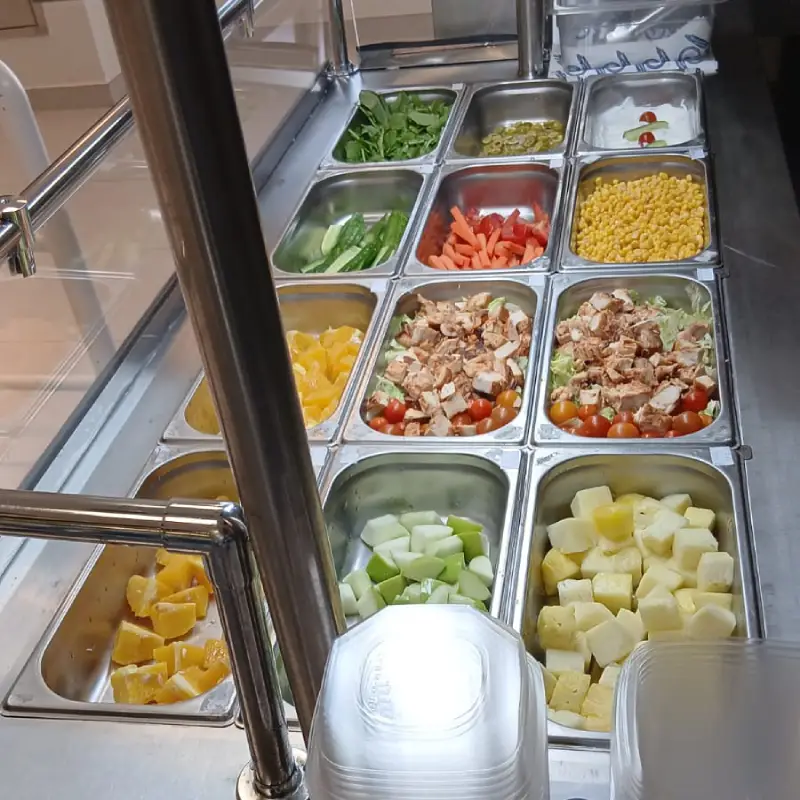 Salad bar with fresh vegetables and fruit