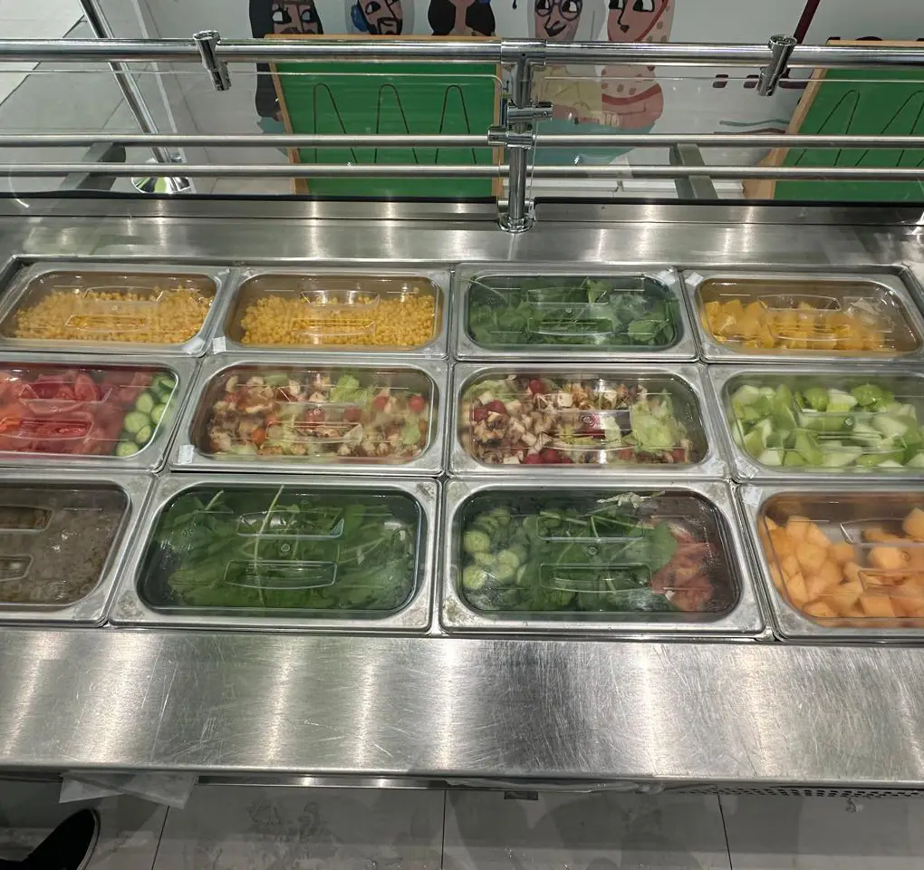 Salads and side dishes on a buffet line