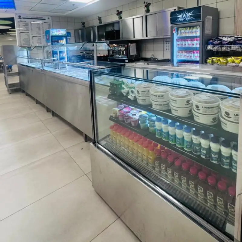 Chilled drinks and desserts display in a school canteen